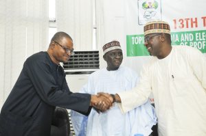 Moddibbo Kawu ,DG of NBC and Chairperson of the occasion in a handshake with Professor Adigun Agbaje of the Universty of Ibadan at the Lecture.